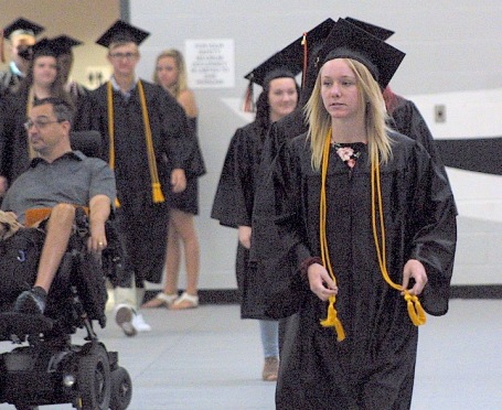 Katelyn Elizabeth Foster enters with the rest of the Class of 2017 Sunday during the Charles City High School graduation ceremony in the district's competition gym. -- Photo by Chris Baldus